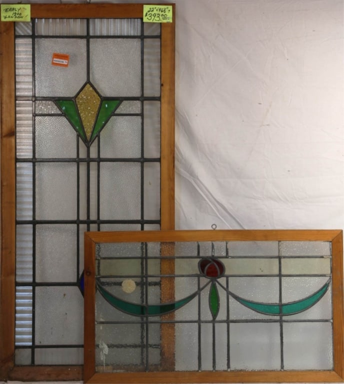 TWO ENGLISH STAINED GLASS PANELS: Two English stained glass panels with multicolored stained glass accents. Approximate dimensions: h. 46.5", w. 22" Disclaimer: This is an online court ordered bankruptcy sale. Participating bidders mu