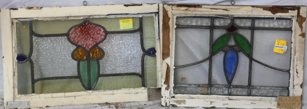 TWO CONTINENTAL STAINED GLASS PANELS: Two Continental stained glass panels with intricate multicolored glass details. Approximate dimensions: h. 15", w. 25" Disclaimer: This is an online court ordered bankruptcy sale. Participating bidder