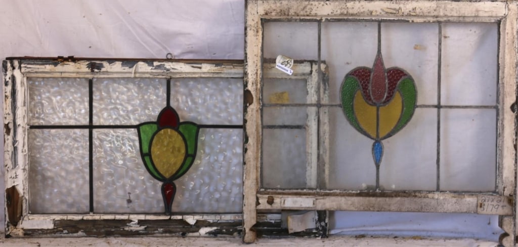 TWO CONTINENTAL STAINED GLASS PANELS: Two Continental stained glass panels with multicolored stained glass details. Approximate dimensions: h. 21", w. 27" Disclaimer: This is an online court ordered bankruptcy sale. Participating bidders