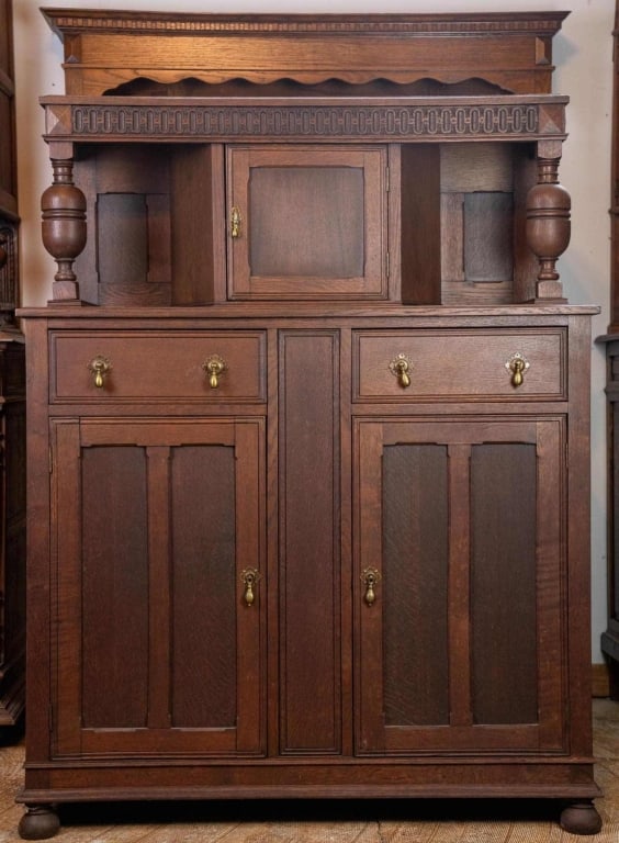 ENGLISH OAK CHIFFONIER: English oak chiffonier with bun feet, brass drop pulls, carved details. Approximate dimensions: h. 60", w. 46.5", d. 22.25" Disclaimer: This is an online court ordered bankruptcy sale. Participating b