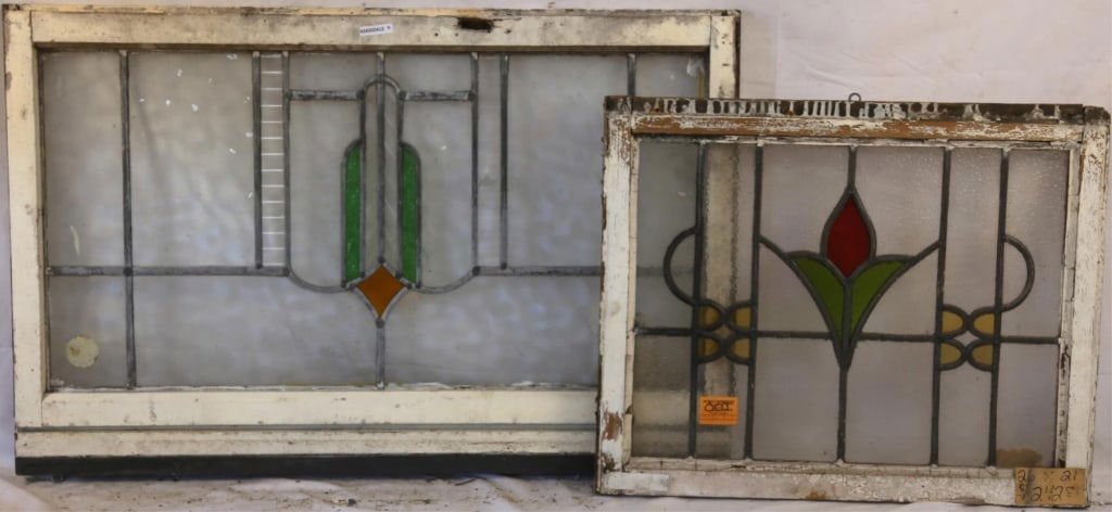 TWO CONTINENTAL STAINED GLASS PANELS: Two Continental stained glass panels with multicolored glass accents. Approximate dimensions: h. 26", w. 39" Disclaimer: This is an online court ordered bankruptcy sale. Participating bidders must hav