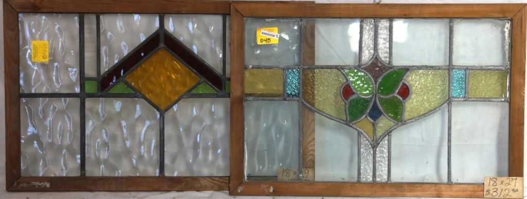TWO CONTINENTAL STAINED GLASS PANELS: Two Continental stained glass panels with multicolored stained glass accents. Approximate dimensions: h. 18", w. 27" Disclaimer: This is an online court ordered bankruptcy sale. Participating bidders