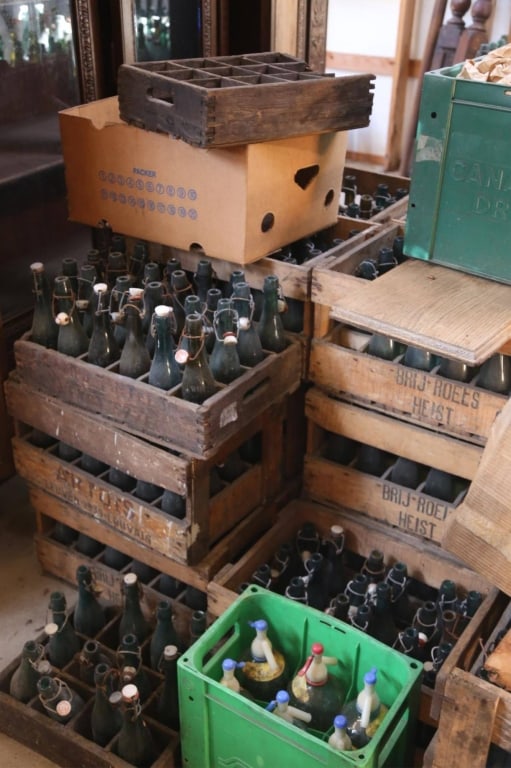 10 CASES OF ANTIQUE FRENCH BEER & WINE BOTTLES: Ten cases of antique French beer and wine bottles contained in period French wooden crates. Disclaimer: This is an online court ordered bankruptcy sale. Participating bidders must have a credit card o