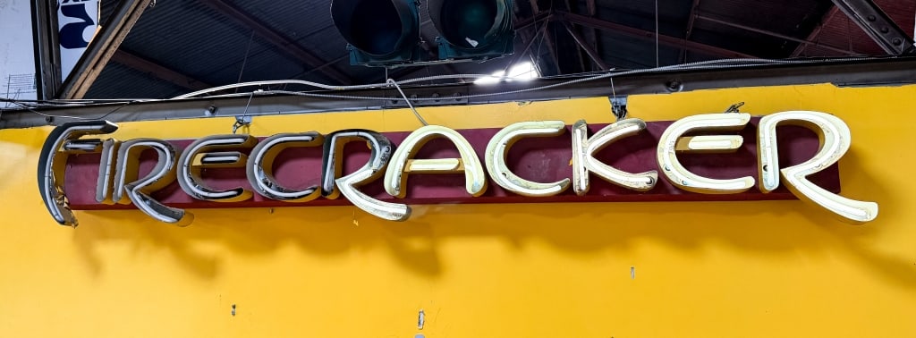 VINTAGE FIRECRACKER NEON SIGN: Vintage "Firecracker" neon sign. Approximate dimensions: h. 15", w. 134", d. 10" Disclaimer: Participating bidders must have a credit card on file with LiveAuctioneers in order for their bidding