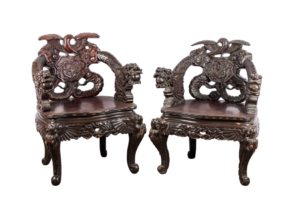 PAIR OF CHINESE HAND-CARVED ARMCHAIRS: Pair of Chinese hand-carved armchairs with dragon head arms and phoenix finials. Approximate dimensions: h. 34", w. 28", d. 22" Disclaimer: Participating bidders must have a credit card on file with