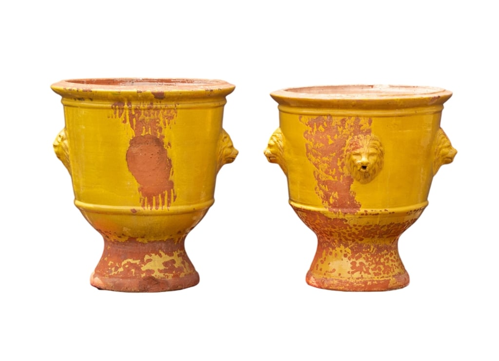 PAIR OF VINTAGE FRENCH TERRACOTTA PLANTERS: Pair of vintage French Terracotta planters with lion head accents. Marked "Pour de Jardin La Provence". Approximate dimensions: h. 36", dia. 32" Disclaimer: Participating bidders must have a credit