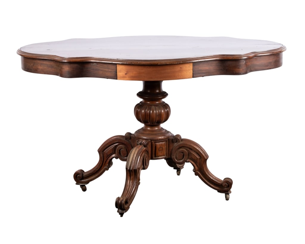 AMERICAN VICTORIAN MAHOGANY PARLOR TABLE: American Victorian mahogany parlor table with one drawer and scrolled feet. Approximate dimensions: h. 29", w. 50", d. 33" Disclaimer: Participating bidders must have a credit card on file with