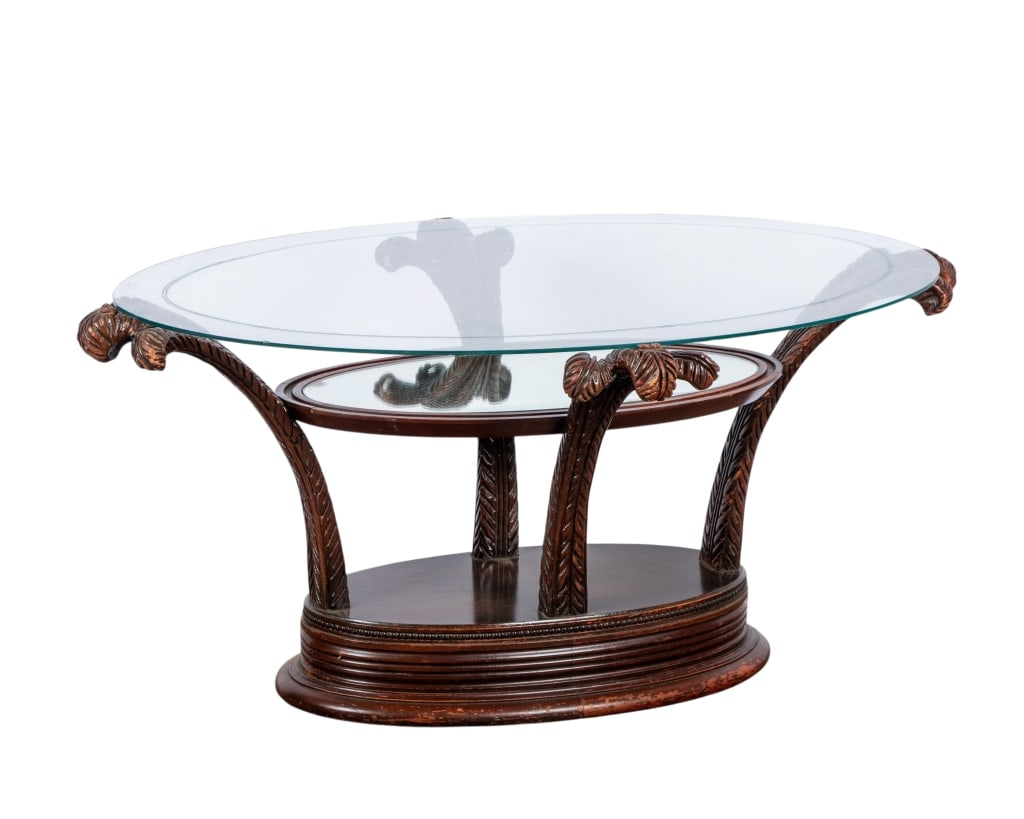 HOLLYWOOD REGENCY MIRRORED COFFEE TABLE: Hollywood Regency mirrored coffee table with carved supports. Approximate dimensions: h. 18", w. 37", d. 24" Disclaimer: Participating bidders must have a credit card on file with LiveAuctioneers in