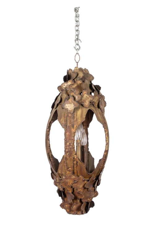 ATTR. TOM GREENE BRASS PENDANT: Attributed to Tom Greene brass pendant with layered cut brass leaves and burnished patinated finish. Approximate dimensions: h. 30", dia. 10.5" Disclaimer: Participating bidders must have a credit