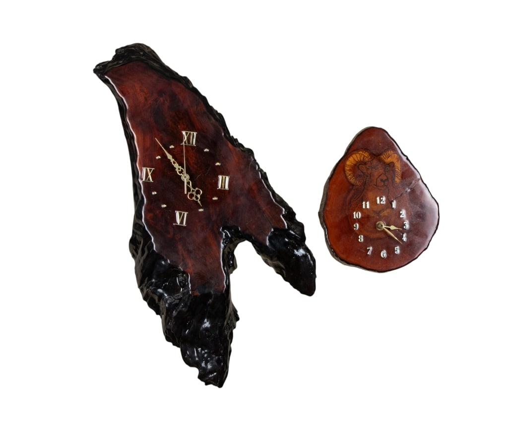 PAIR OF 20TH CENTURY BARKWOOD WALL CLOCKS: Pair of 20th century Barkwood wall clocks, both battery operated. Approximate dimensions: h. 24", w. 21", d. 2.5" Disclaimer: Participating bidders must have a credit card on file with