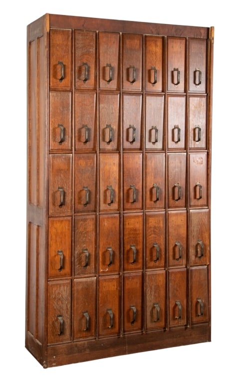 ANTIQUE 35-DRAWER VERTICAL FILE CABINET: Antique 35-drawer vertical file cabinet. Approximate dimensions: h. 86", w. 47", d. 17" Disclaimer: Participating bidders must have a credit card on file with LiveAuctioneers in order for their biddin