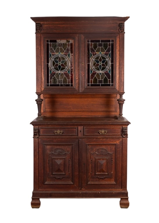 FRENCH RENAISSANCE REVIVAL STAINED GLASS BUFFET: French Renaissance Revival buffet with stained glass panels, lion head carved accents with brass ring pulls, inset carved panels. Approximate dimensions: h. 87.5", w. 44.5", d. 19" Disclaimer: