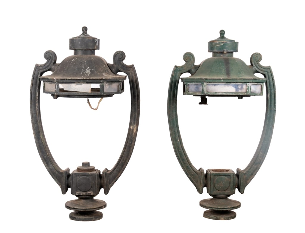 PAIR OF CINCINNATI STREET LIGHT LAMP POSTS: Pair of Cincinnati iron street light lamp posts. Approximate dimensions: h. 42.5", w. 24", d. 24" Disclaimer: Participating bidders must have a credit card on file with LiveAuctioneers in order for