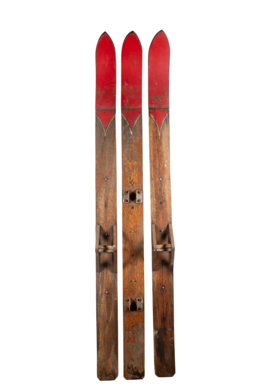 VINTAGE WOODEN SKIS: Vintage wooden skis. Approximate dimensions: h. 102", w. 6.5", d. 7" Disclaimer: Participating bidders must have a credit card on file with LiveAuctioneers in order for their bidding registration to