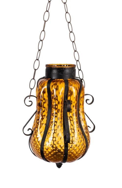 WROUGHT IRON & SWAG AMBER GLASS PENDANT LIGHT: Wrought iron and swag amber glass pendant light. Approximate dimensions: h. 14", dia. 9" Disclaimer: Participating bidders must have a credit card on file with LiveAuctioneers in order for their