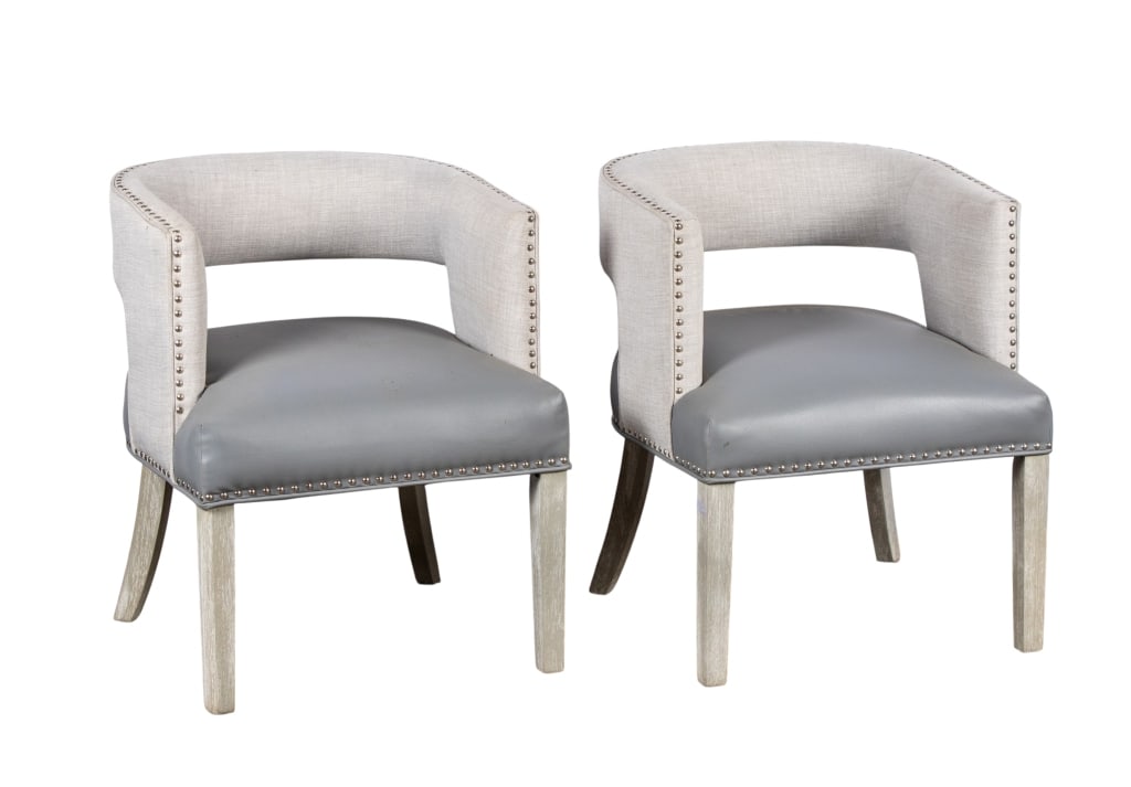 PAIR OF CONTEMPORARY ACCENT CHAIRS: Pair of contemporary accent chairs with nailhead trim accents and grey faux leather seats. Approximate dimensions: h. 30", w. 23", d. 21" Disclaimer: Participating bidders must have a credit card on f