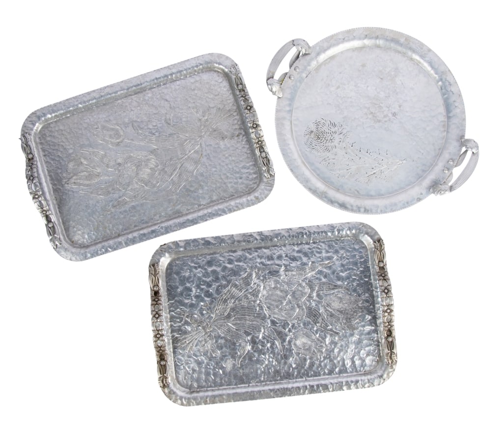 THREE ART NOUVEAU STYLE PEWTER FLORAL TRAYS: Three Art Nouveau style pewter floral trays. Approximate dimensions: h. 2", w. 16.5", d. 11.5" Disclaimer: Participating bidders must have a credit card on file with LiveAuctioneers in order for their