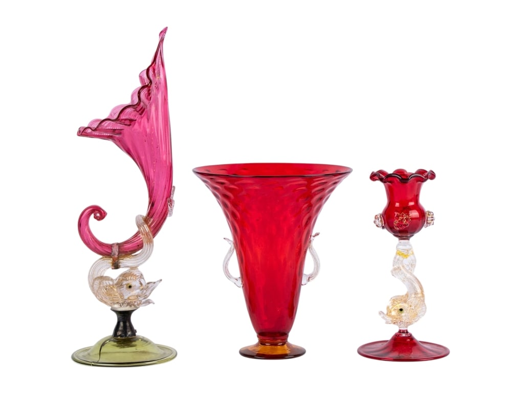 COLLECTION OF 3 CRANBERRY GLASS ITEMS: Collection of 3 cranberry glass items. Approximate dimensions: h. 12", dia. 4" Disclaimer: Participating bidders must have a credit card on file with LiveAuctioneers in order for their bidding registr