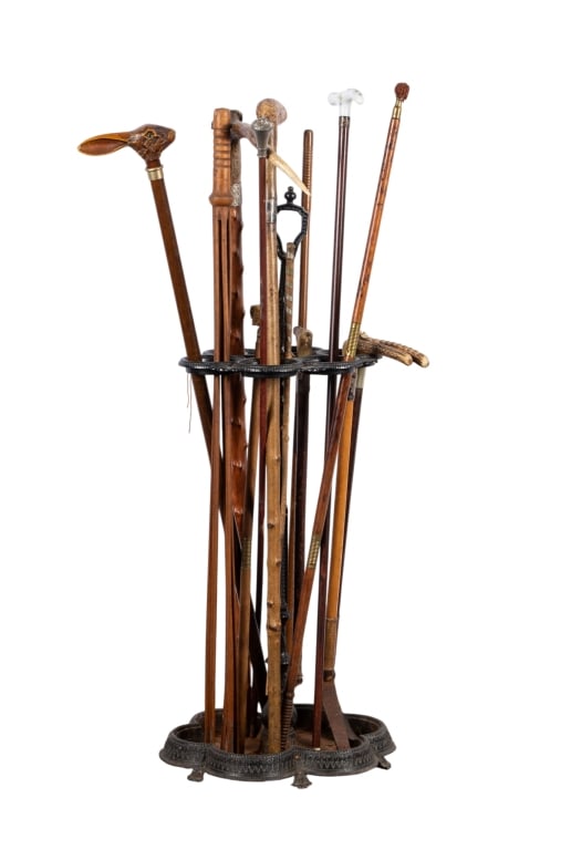 VINTAGE UMBRELLA STAND WITH CROPS & CANES: Vintage umbrella stand with 3 riding crops and 8 walking canes. Approximate dimensions: stand h. 31", w. 11", d. 9" Disclaimer: Participating bidders must have a credit card on file with LiveAuctionee