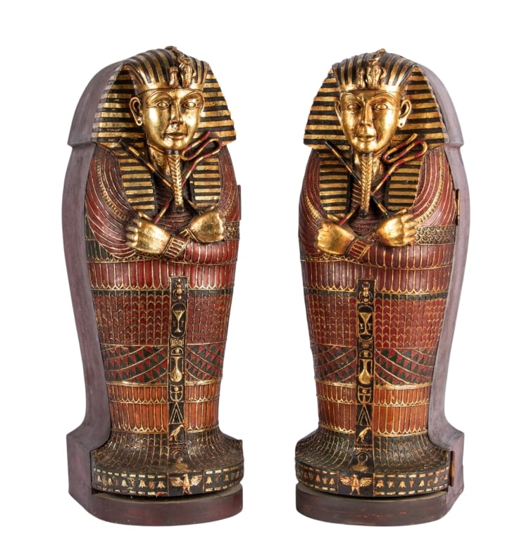 PAIR OF EGYPTIAN SARCOPHAGUS CABINETS: Pair of Egyptian sarcophagus cabinets. Approximate dimensions: h. 26.5", w. 9", d. 11" Disclaimer: Participating bidders must have a credit card on file with LiveAuctioneers in order for their