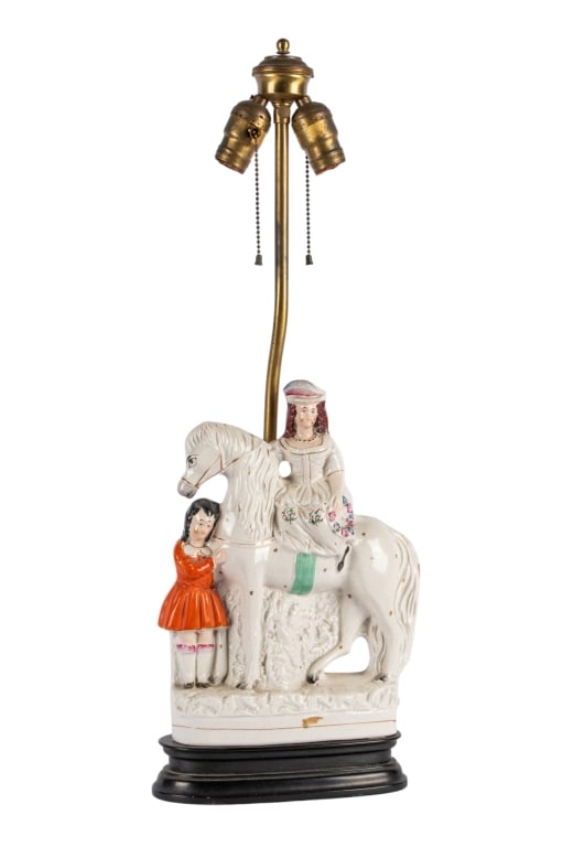 ANTIQUE ENGLISH FIGURAL PORCELAIN LAMP: Antique English figural porcelain lamp depicting a male, female and a horse. Approximate dimensions: h. 26", w. 8", d. 3" Disclaimer: Participating bidders must have a credit card on file with