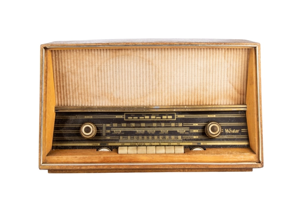 VINTAGE WESTAR RADIO: Vintage Westar radio. Approximate dimensions: h. 12", w. 20", d. 9" Disclaimer: Participating bidders must have a credit card on file with LiveAuctioneers in order for their bidding registration to be
