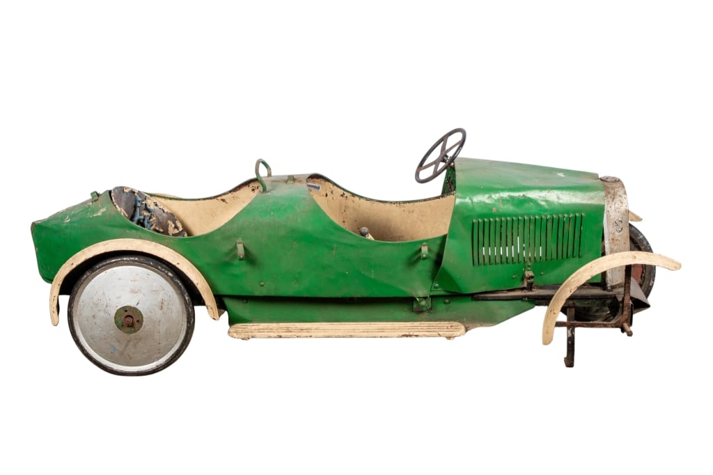 VINTAGE BUGATTI STYLE CHILD’S PEDAL CAR: Vintage Bugatti style child’s pedal car. Approximate dimensions: h. 22", w. 21", d. 65" Disclaimer: Participating bidders must have a credit card on file with LiveAuctioneers in order for their