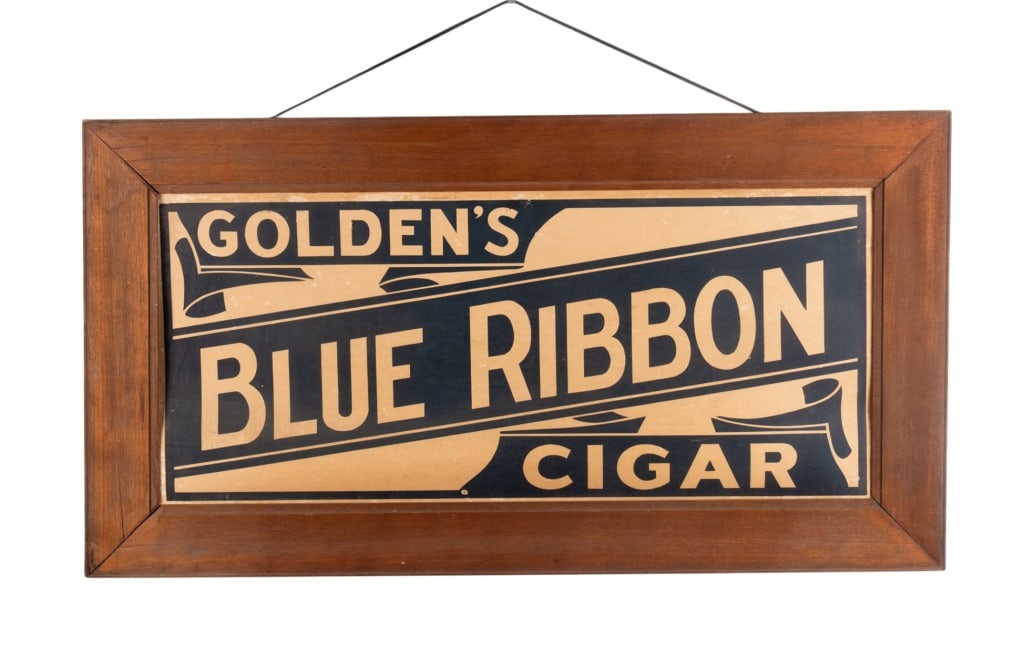 GOLDEN’S CIGAR BLUE RIBBON ADVERTISING SIGN: Golden’s Cigar Blue Ribbon advertising sign. Framed. Approximate dimensions: h. 23", w. 42.5", d. 0.75" Disclaimer: Participating bidders must have a credit card on file with LiveAuctioneers in