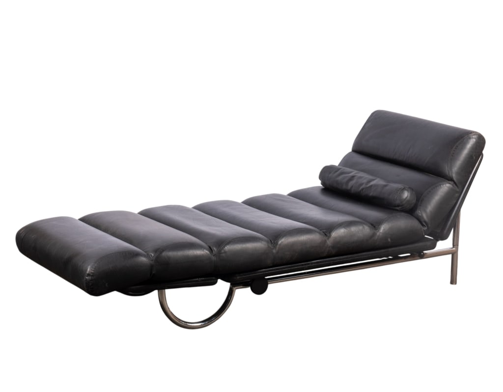 MODERN QUOTA LEATHER CHAISE LOUNGE: Modern Quota leather chaise lounge with chromed tubular base. Approximate dimensions: h. 29", w. 29", d. 78" Disclaimer: Participating bidders must have a credit card on file with LiveAuctioneers in o