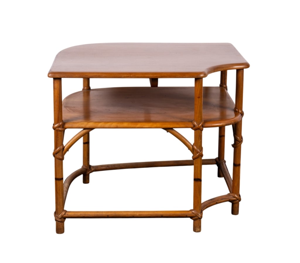 HEYWOOD WAKEFIELD FAUX BAMBOO CORNER TABLE: Heywood Wakefield (American), 20th century. Faux bamboo & birdseye maple corner table with rattan accents. Marked to underside. Approximate dimensions: h. 22", w. 37", d. 29" Disclaimer: