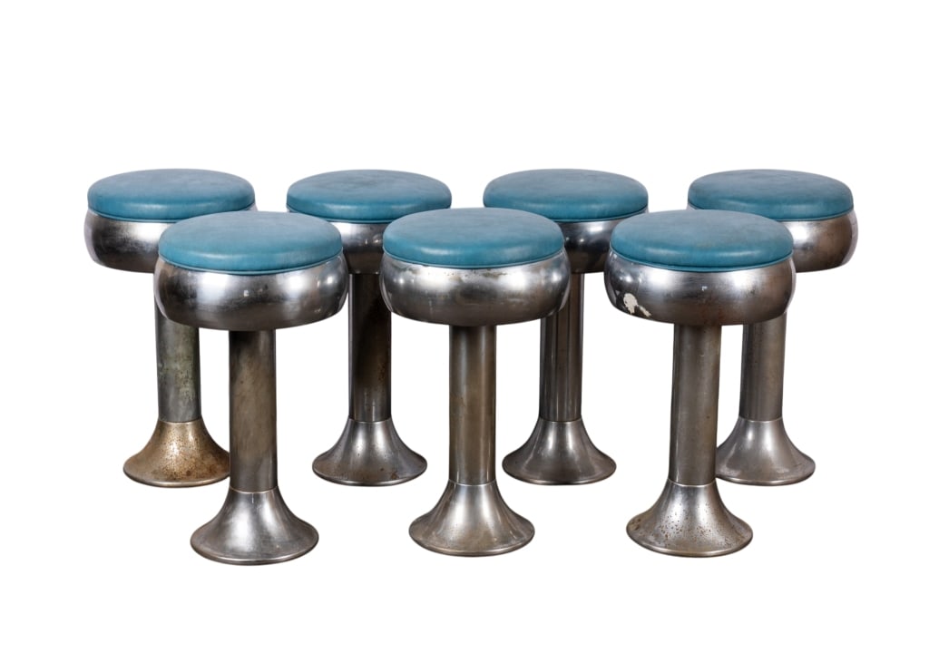 SET OF 7 BLUE & CHROME DINER BAR STOOLS: American, 20th century. Set of seven blue and chrome diner bar stools. Approximate dimensions: h. 24", dia. 12" Disclaimer: Participating bidders must have a credit card on file with LiveAuctioneers