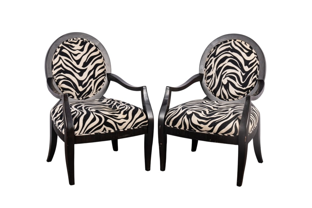 PAIR OF MODERN ZEBRA PRINT ACCENT CHAIRS: Pair of modern zebra print accent chairs. Approximate dimensions: h. 38", w. 24.5", d. 28" Disclaimer: Participating bidders must have a credit card on file with LiveAuctioneers in order for their