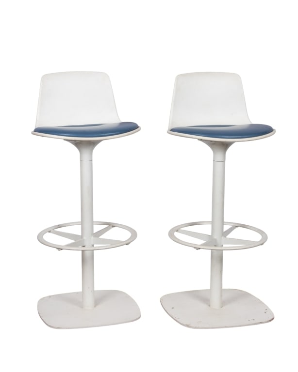 PAIR OF MID CENTURY ENEA LOTTUS BAR STOOLS: black vinyl seats Approximate dimensions: h. 39", w. 17.5", d. 17" Disclaimer: Participating bidders must have a credit card on file with LiveAuctioneers in order for their bidding registration to be