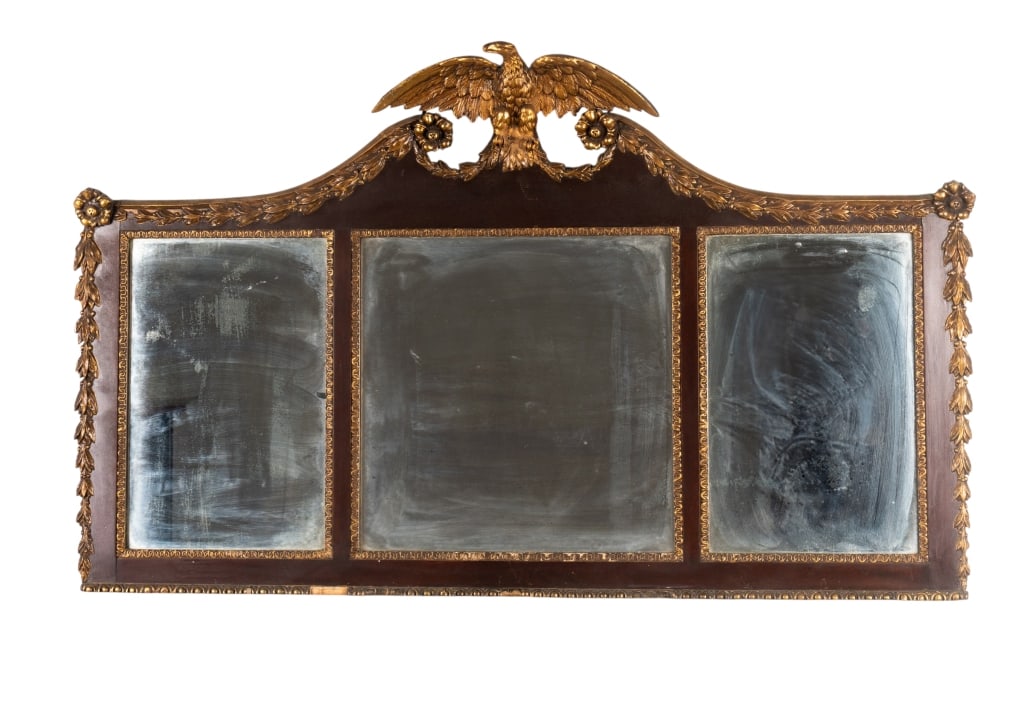 FEDERAL STYLE MAHOGANY & GILTWOOD MIRROR: Federal style mahogany and giltwood overmantel mirror with triple mirrors, gilt accents, and eagle crest. Approximate dimensions: h. 32.5", w. 48.5", d. 4" Disclaimer: Participating bidders must have