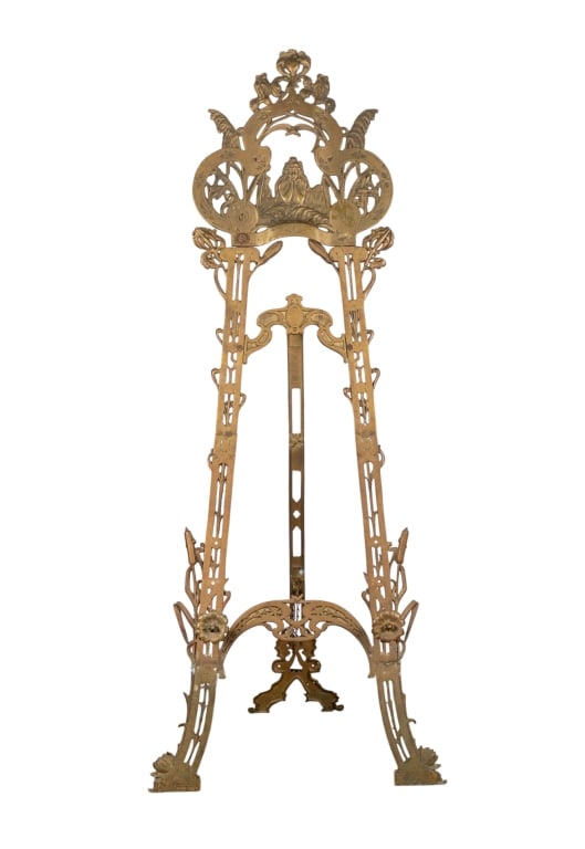 ART NOUVEAU STYLE BRASS EASEL: Art Nouveau Style brass easel with floral and figural accents and elaborate details. Approximate dimensions: h. 66.25", w. 27", d. 22" Disclaimer: Participating bidders must have a credit card on file