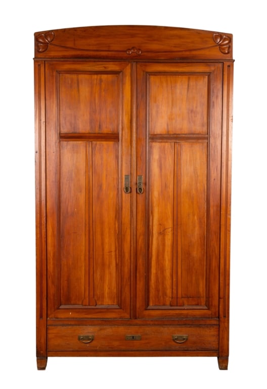 AMERICAN ART NOUVEAU PINE ARMOIRE: American Art Nouveau pine armoire with floral carved crown, inset panels, brass pulls. Approximate dimensions: h. 83", w. 48", d. 22.75" Disclaimer: Participating bidders must have a credit card on