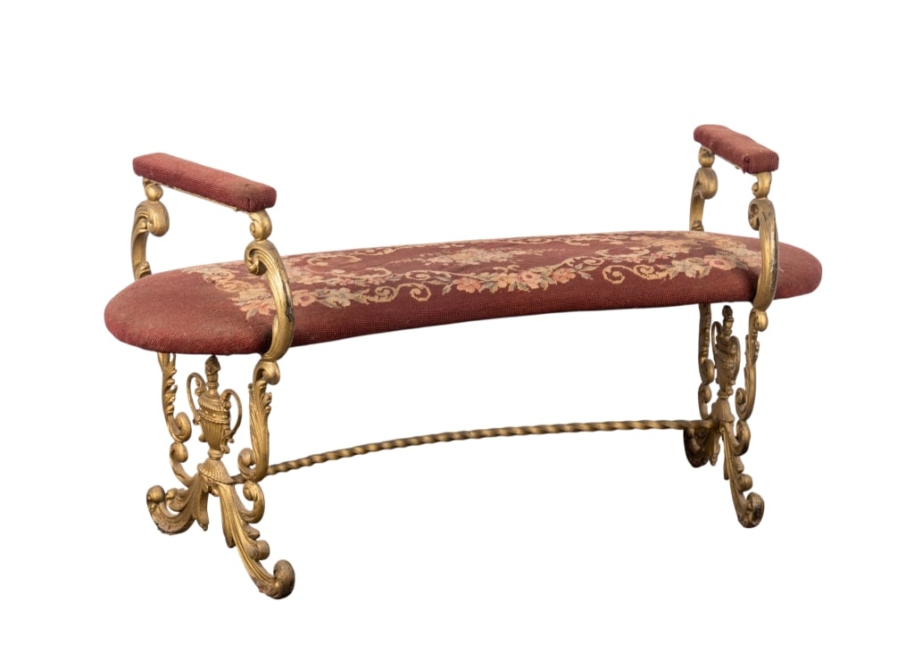 VICTORIAN BRASS NEEDLEPOINT BENCH: Victorian brass needlepoint bench with floral upholstery and urn form sides. Approximate dimensions: h. 24", w. 46", d. 19" Disclaimer: Participating bidders must have a credit card on file with