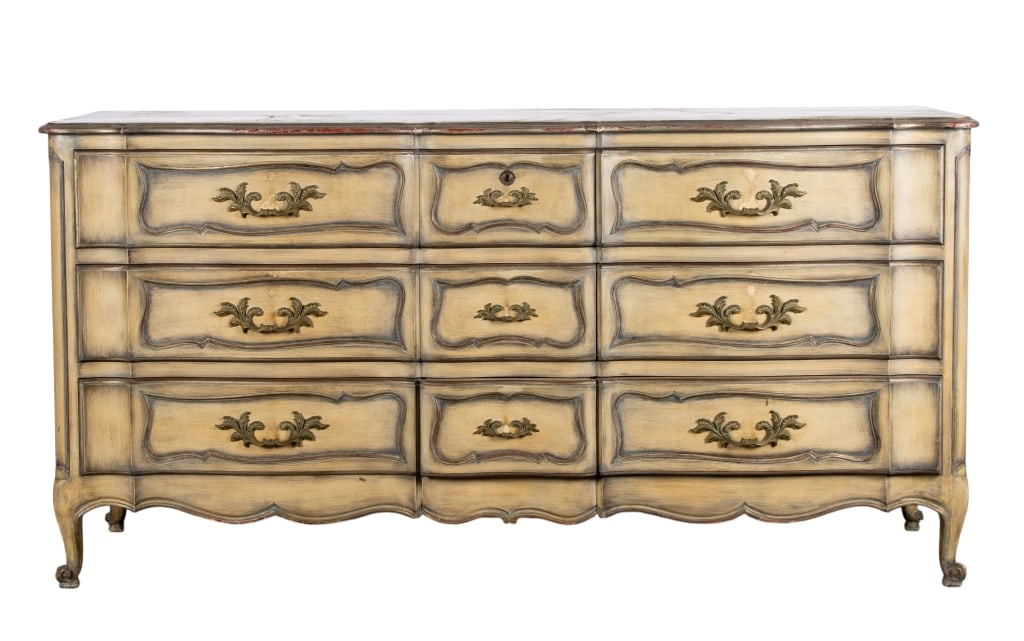 20TH CENTURY FRENCH PROVINCIAL STYLE DRESSER: 20th century French Provincial style dresser with 9 drawers, inset carved panels, and botanical motif pulls. Approximate dimensions: h. 35.5", w. 69.5", d. 21" Disclaimer: Participating bidders must