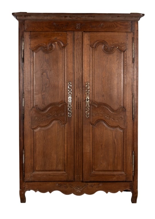 19TH CENTURY FRENCH OAK ARMOIRE: 19th century French oak armoire with inset carved panels and carved floral accents. Approximate dimensions: h. 80", w. 52", d. 22" Disclaimer: Participating bidders must have a credit card on file