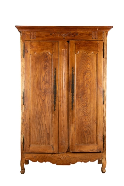 19TH CENTURY FRENCH OAK ARMOIRE: 19th century French oak armoire with inset carved panels and carved apron. Approximate dimensions: h. 83", w. 49", d. 21" Disclaimer: Participating bidders must have a credit card on file with LiveAuc