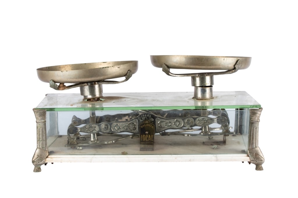 EARLY 20TH CENTURY ARGENTINIAN BALANCE SCALE: Early 20th century Argentinian balance scale. Approximate dimensions: h. 14.5", w. 27", d. 13" Disclaimer: Participating bidders must have a credit card on file with LiveAuctioneers in order for