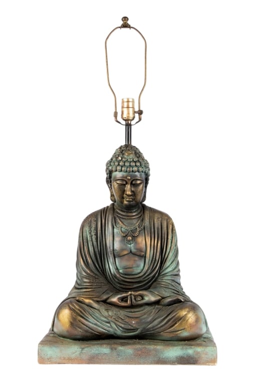 MODERN SEATED BUDDHA TABLE LAMP: Modern seated Buddha table lamp. Approximate dimensions: h. 32", w. 16", d. 11" Disclaimer: Participating bidders must have a credit card on file with LiveAuctioneers in order for their bidding