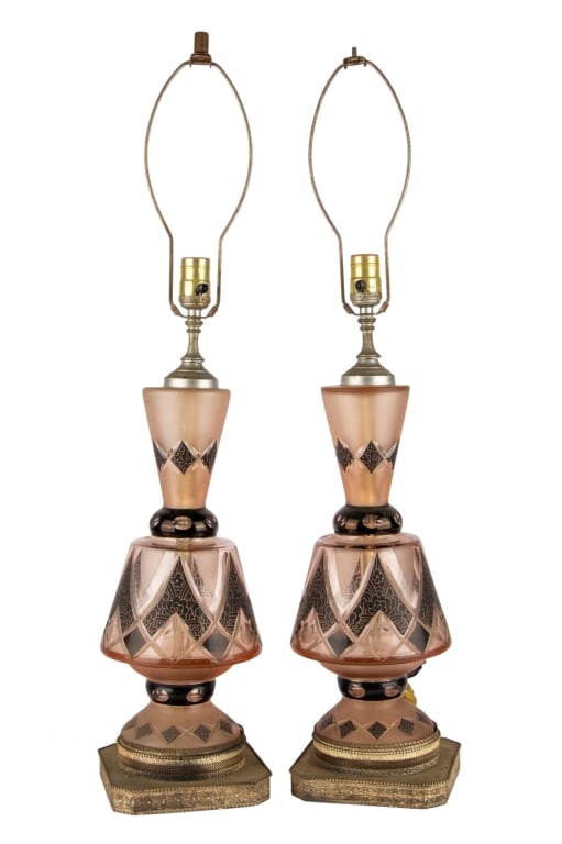 PAIR OF MID-CENTURY CUT CRYSTAL TABLE LAMPS: Pair of Mid-century cut crystal table lamps in pink with black floral etched details and brass base. Approximate dimensions: h. 23", w. 7", d. 7" Disclaimer: Participating bidders must have a credit