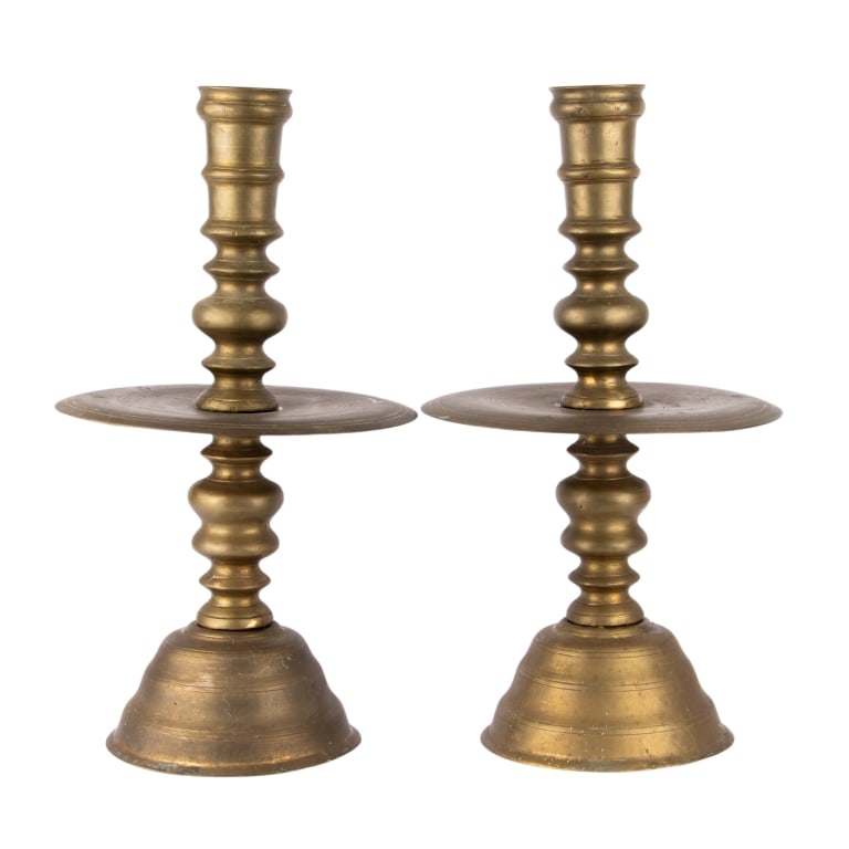 PAIR OF BRASS ALTAR CANDLE HOLDERS: Pair of brass altar candle holders. Approximate dimensions: h. 21", dia. 12" Disclaimer: Participating bidders must have a credit card on file with LiveAuctioneers in order for their bidding