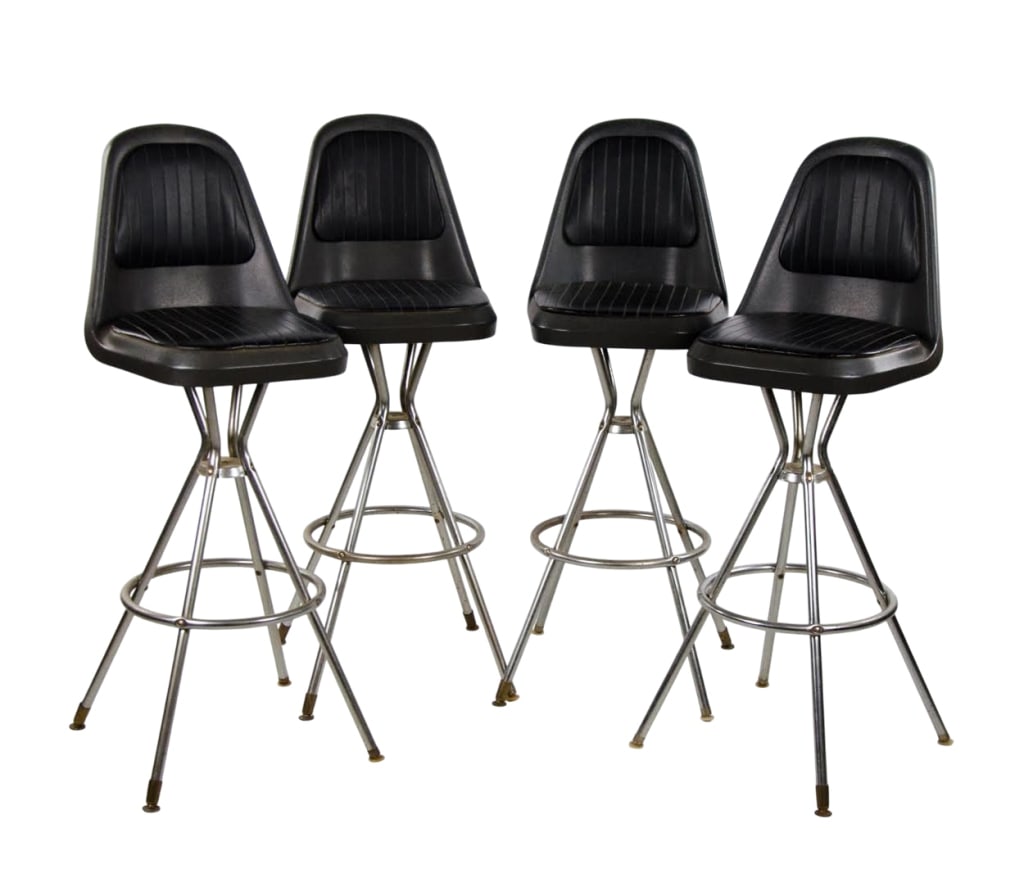 SET OF 4 COMFORT LINE SWIVEL BARSTOOLS: Set of 4 Comfort Line swivel barstools with metal base and plastic seat with faux leather upholstery. Approximate dimensions: h. 42", w. 15", d. 16" Disclaimer: Participating bidders must have a
