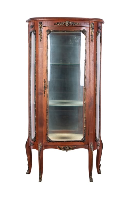 LOUIS XV STYLE CURIO CABINET: Louis XV style curio cabinet with 2 glass shelves, mirrored back, and metallic brushed floral accents. Approximate dimensions: h. 54.5", w. 28", d. 13" Disclaimer: Participating bidders must have a