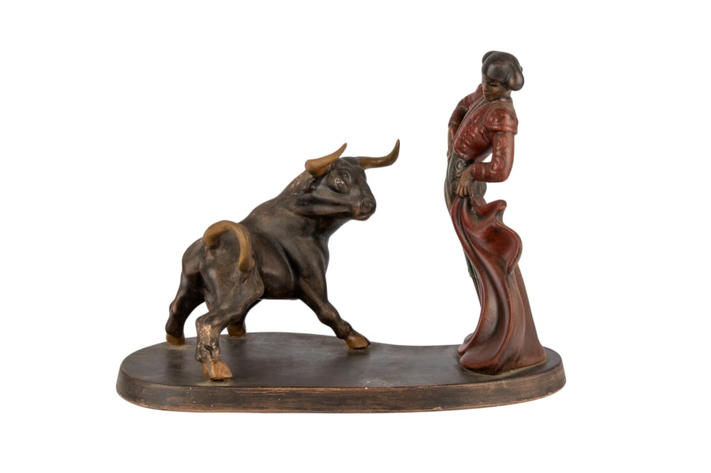 MATADOR & BULL SCULPTURE: Ceramic matador and bull sculpture. Signed to base. Approximate dimensions: h. 13", w. 17", d. 8.5" Disclaimer: Participating bidders must have a credit card on file with LiveAuctioneers in order for