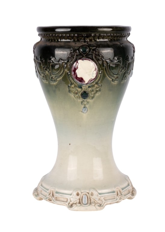 WELLER POTTERY PLANT STAND WITH CAMEO ACCENTS: Weller pottery plant stand with cameo accents and gradient glazed surface. Approximate dimensions: h. 16.5", w. 9.5" Disclaimer: Participating bidders must have a credit card on file with