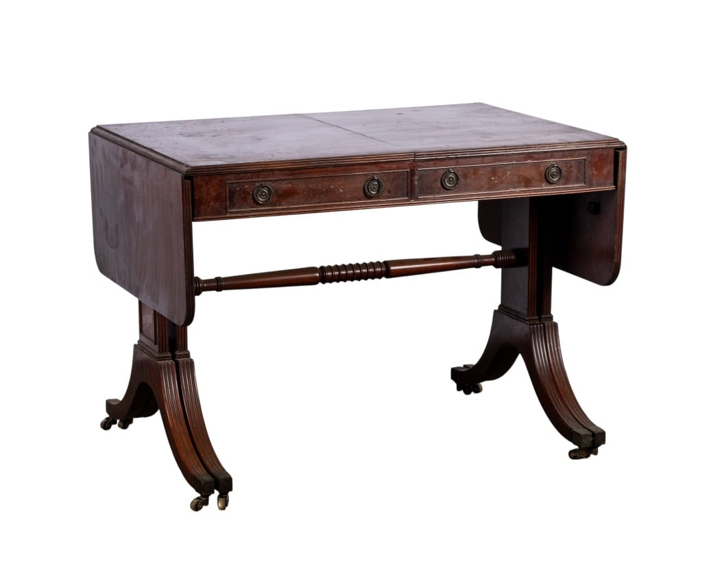 19TH C. HEPPLEWHITE STYLE WALNUT DROP LEAF TABLE: castered legs, two leaves, carved details Approximate dimensions: h. 28", w. 35", d. 26" Disclaimer: Participating bidders must have a credit card on file with LiveAuctioneers in order for their