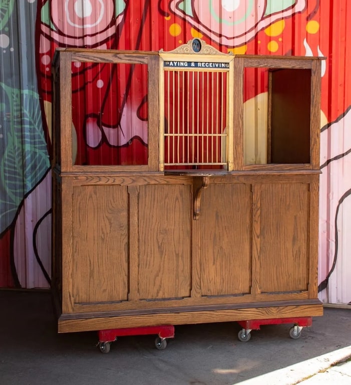 BANK CLERK TELLER?S COUNTER BOOTH: Paying & Receiving Approximate dimensions: h. 73", w. 74", d. 35" Disclaimer: Participating bidders must have a credit card on file with LiveAuctioneers in order for their bidding registration to be